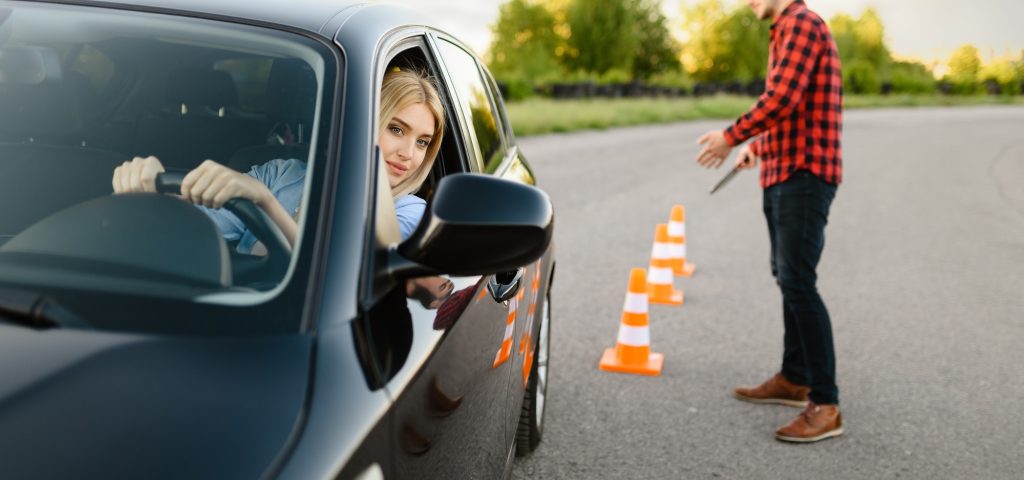 male-instructor-happy-with-driving-of-his-student.jpg